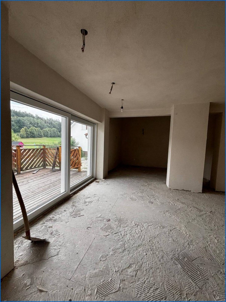 1. OG Wohnzimmer mit Schiebet�r Etagenwohnung M�hlingen / Zoznegg