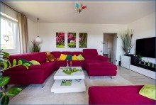 EG-Wohnzimmer 3 Attraktives Dreifamilienhaus mit zwei Doppelgaragen und umfassender Modernisierung als Renditeobjekt